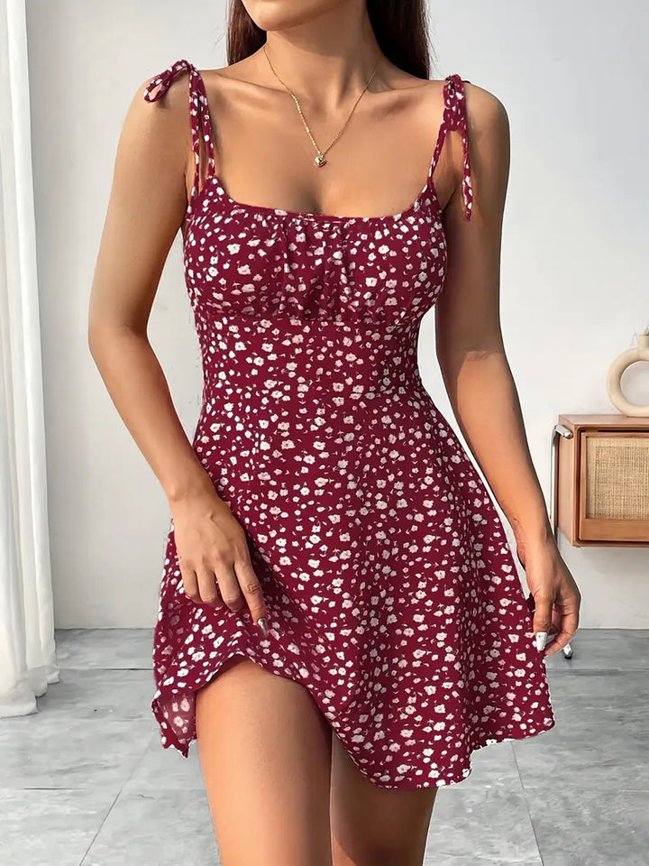 Vestido mini floral para mujer con tirantes anudados y bajo acampanado